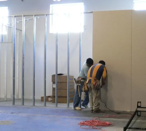 The first bits of drywall go up