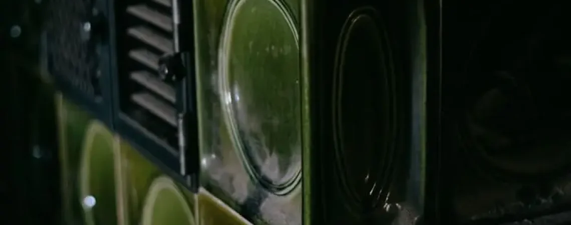 a close up of a green and black cabinet